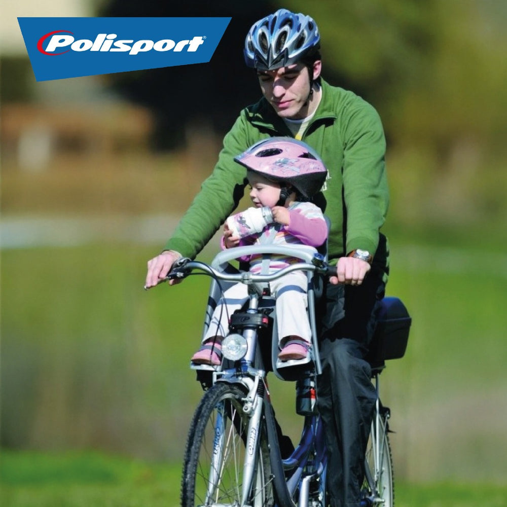 Enfant transporté à l'avant du vélo dans un siège Polisport Bilby Junior